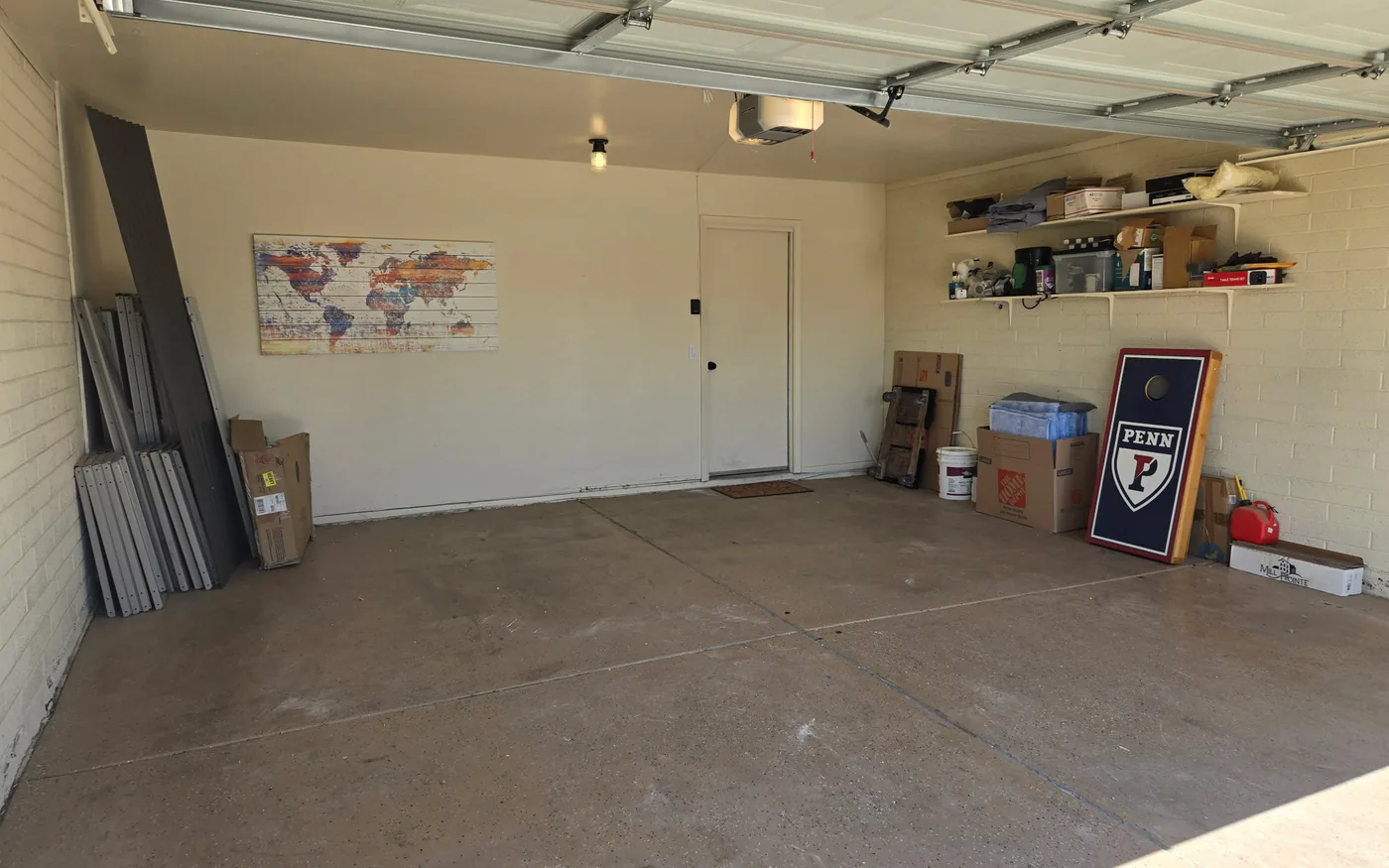 A garage part way through a cleanout with stored
items still stacked along the wall